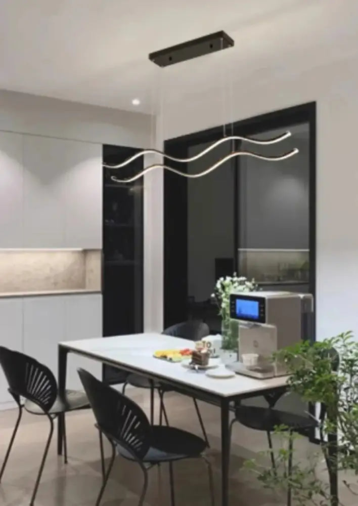 Modern minimalist pendant lights with sleek curved silver metal arms and black rectangular ceiling fixture for dining room decor