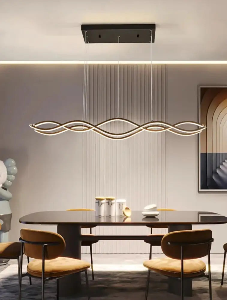 Modern wave-shaped led pendant lights with sleek black frame and warm white curves for dining room decor by decorbites