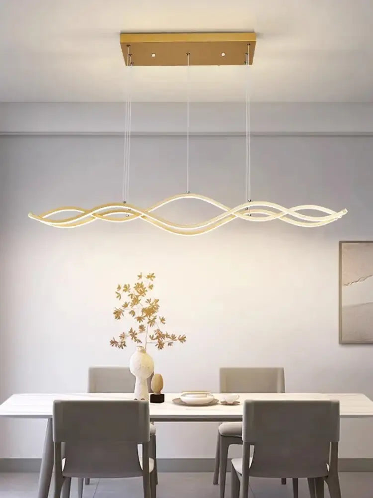 Gold-toned modern led pendant lights with sleek wavy design and three intertwined arms for dining room nordic chandeliers