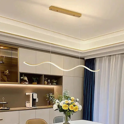 A sleek modern pendant light with smooth curved design and warm white led illumination for dining room lighting nordic chandeliers
