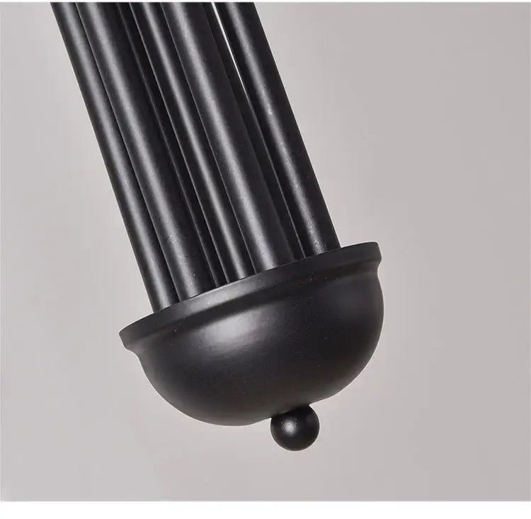 Black matte metal lampshade with fluted ridges and domed base on DecorBites™ nordic comet chandelier for elegant decor