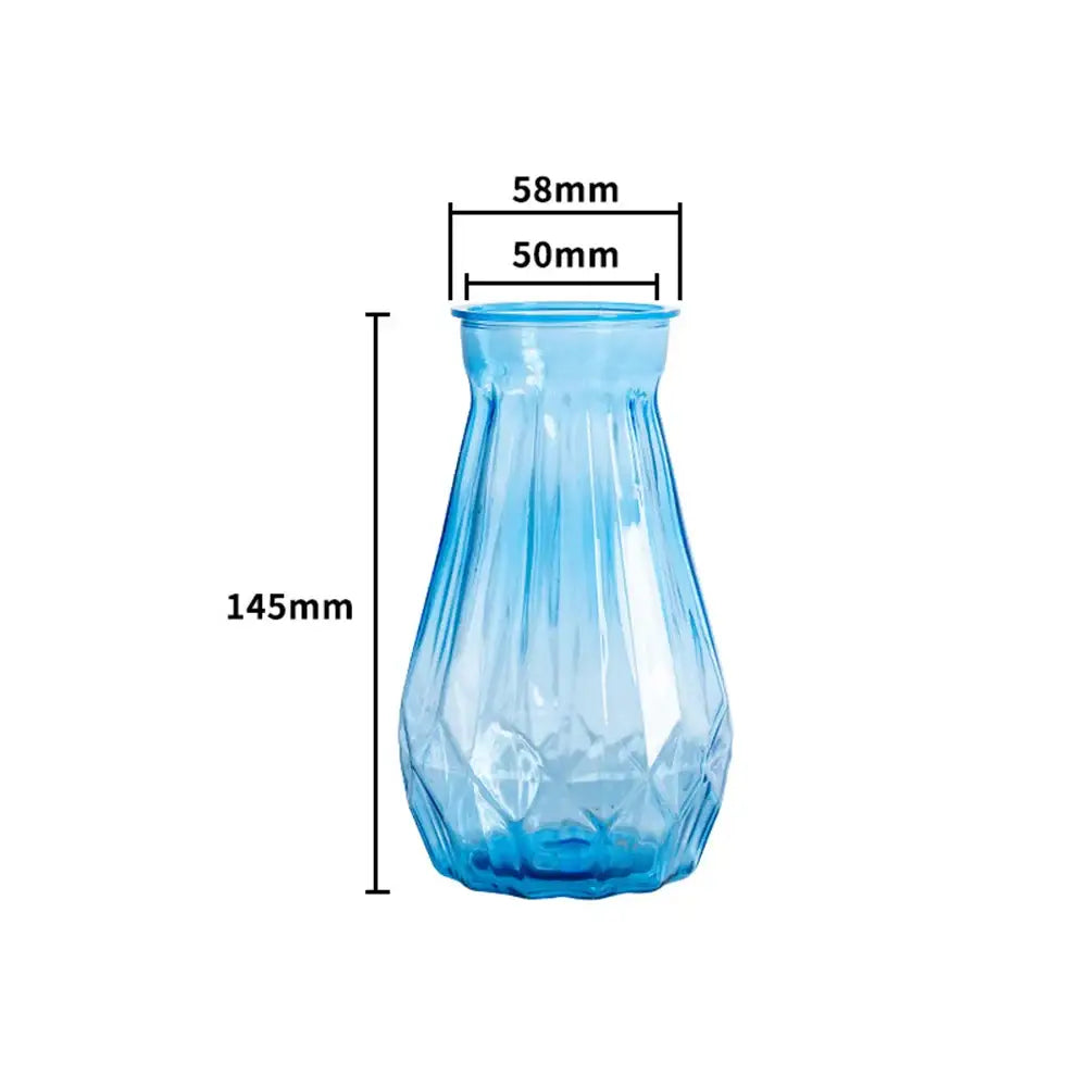 A translucent blue glass nordic flower vase with faceted diamond cut design and fluted rim for modern home decor