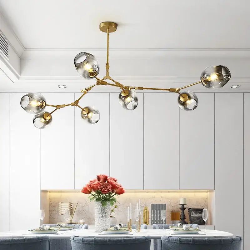 Gold-toned decorbites™ nordic glass ball led chandelier with clear glass globe shades in black and gold finish