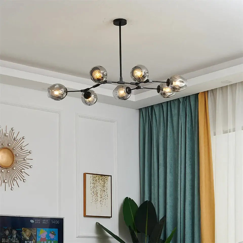 Modern black metal nordic glass ball led chandelier featuring multiple spherical glass globe lights in black gold finish