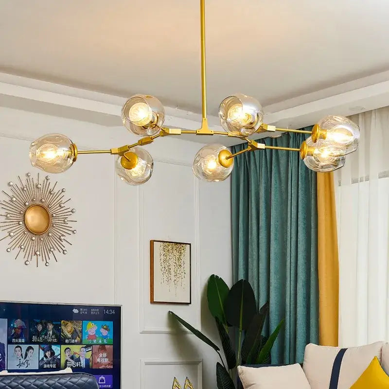 Gold-toned nordic glass ball led chandelier with multiple spherical glass bulbs by DecorBites black gold design