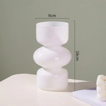 A sleek frosted white glass vase with a modern stacked geometric design for vase home decor by decorbites™