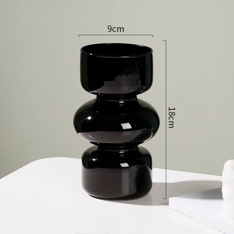 A sleek glossy black ceramic vase with modern stacked design perfect for vase home decor by DecorBites™ Nordic Glass Flower Vase