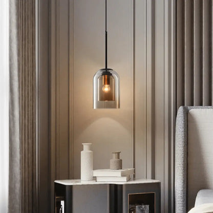 Decorbites™ nordic glass pendant lighting with a sleek bell-shaped smoked glass pendant and black metal frame hanging from a cord