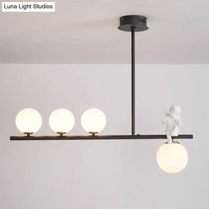 Decorbites™ nordic island angel pendant light with black metal frame, opaline glass shade, and white ceramic cherub