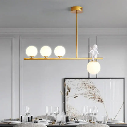 DecorBites Nordic island angel pendant light with gold-toned frame, opaline glass shade, and white cherub figurine