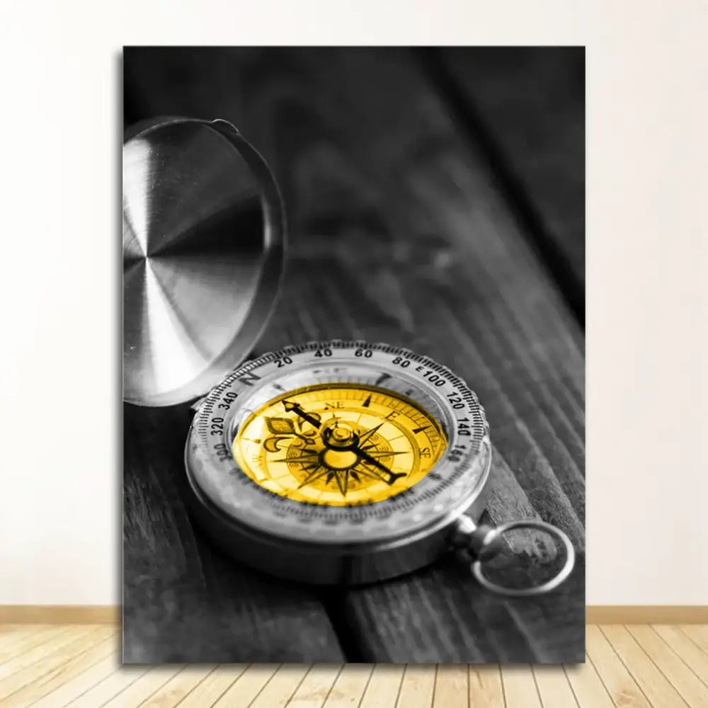 A metallic compass with a yellow face and silver casing complements the decorbites™ nordic landscape canvas print set