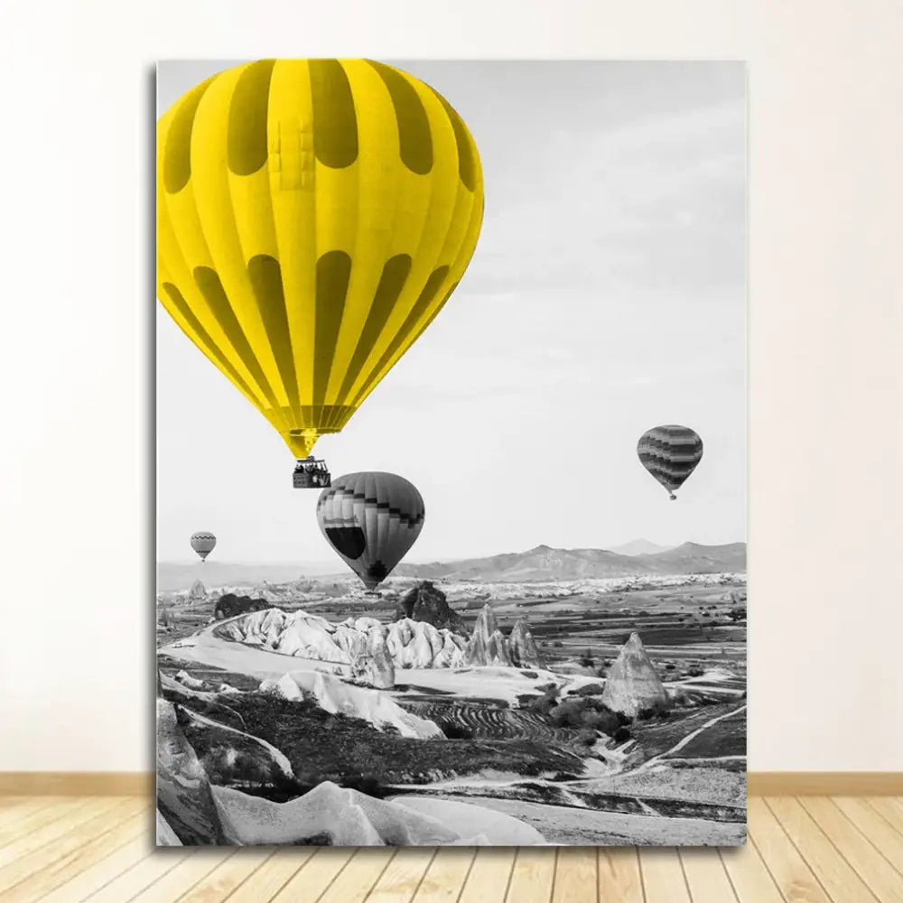 Vibrant yellow hot air balloon with vertical stripes in a nordic landscape canvas black-and-white scenery print
