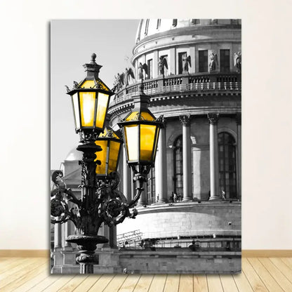 Vintage-style black wrought iron street lamp with three glowing amber lanterns featured in nordic landscape canvas