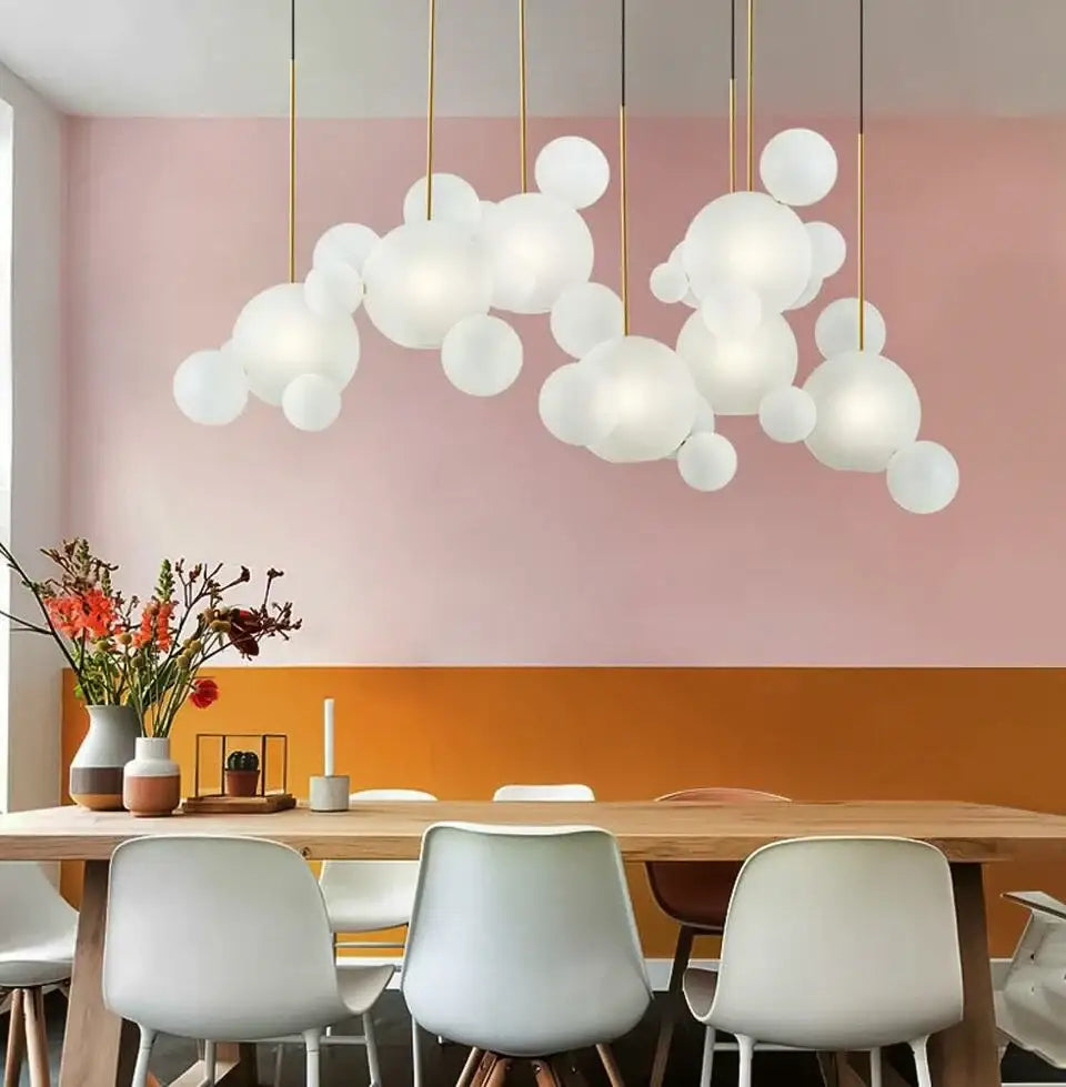 Modern white glass bubble pendant light with gold-toned rods for decor led lighting in living room or dining room