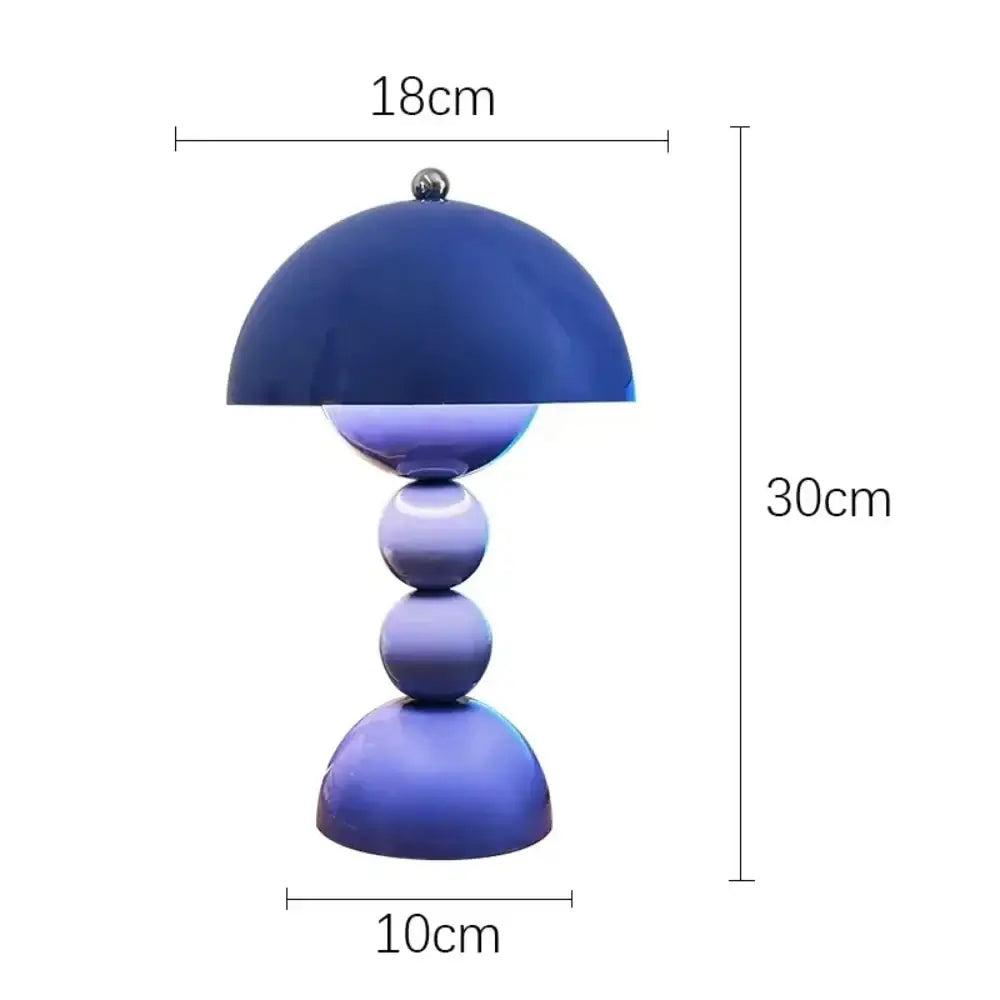 A sleek blue nordic led table lamp with a glossy dome shade and usb dimmable spherical base for bedroom use