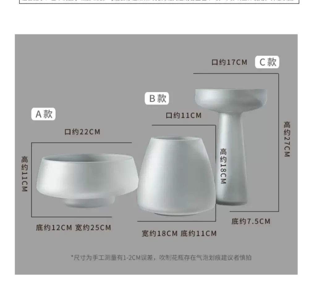 Three white ceramic DecorBites™ nordic luxe frosted glass vases featuring varied shapes for table decoration
