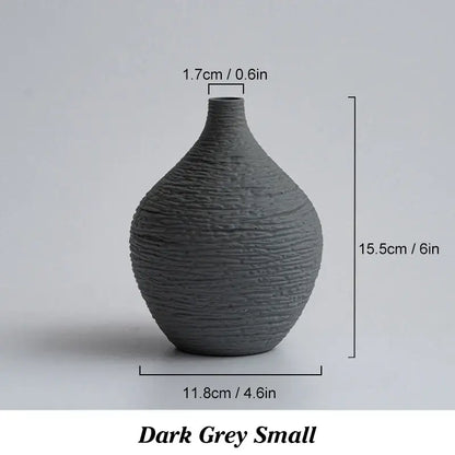 Dark grey ceramic vase with textured ribbed surface and narrow neck from decorbites nordic luxury ceramic collection