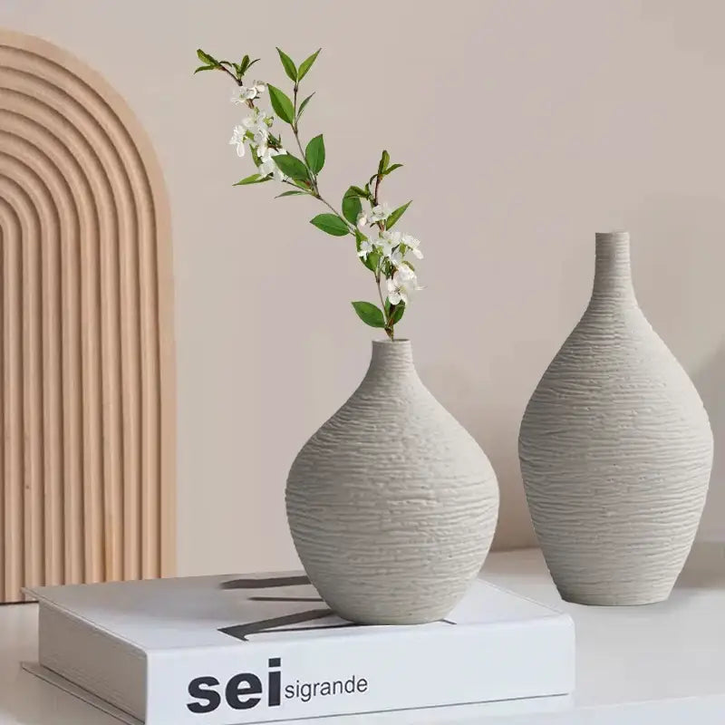 Two off-white textured nordic luxury ceramic vases with ribbed surfaces for elegant home décor by decorbites