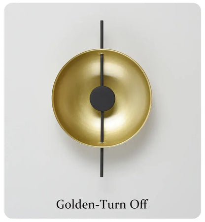 DecorBites™ nordic modern wall sconce in golden brass with a sleek black rod and circular accent for modern wall lighting