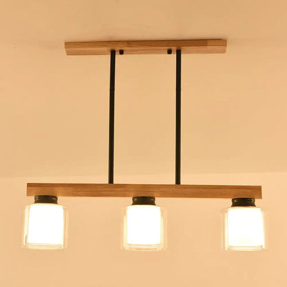 Decorbites nordic modern wood island pendant with three clear glass shades and black metal accents hanging lamp