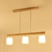 DecorBites™ nordic modern wood island pendant light with three clear glass shades and slender metal rods