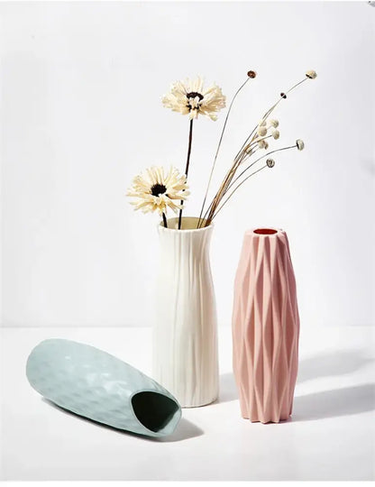 Decorbites™ nordic plastic vase with tall slender silhouette and vertical ribbed texture in soft blush pink ceramic finish