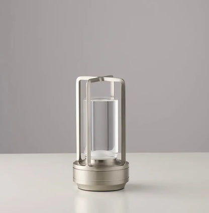 Modern minimalist nordic rechargeable table lamp with brushed stainless steel frame and clear glass cylinder base