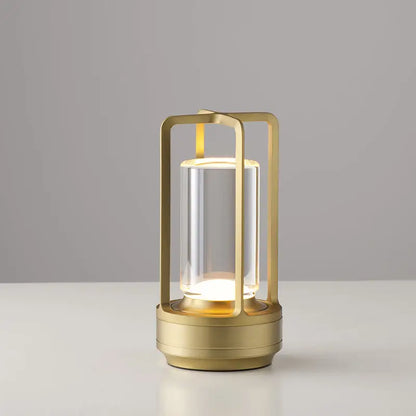 DecorBites™ nordic rechargeable table lamp in gold-toned metal with clear glass and warm led lighting