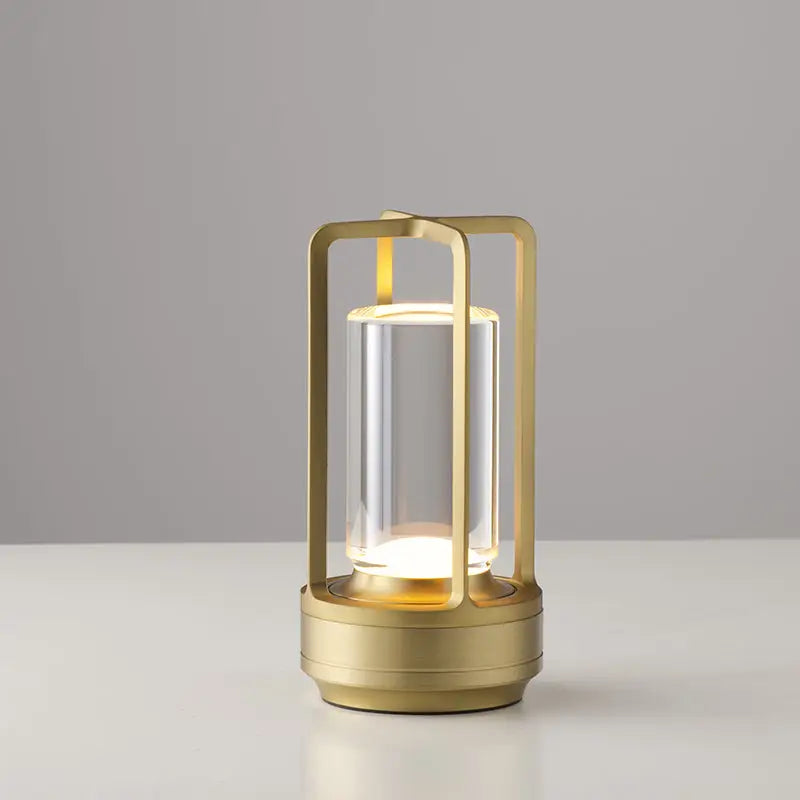 DecorBites™ nordic rechargeable table lamp in gold-toned metal with clear glass and warm led lighting
