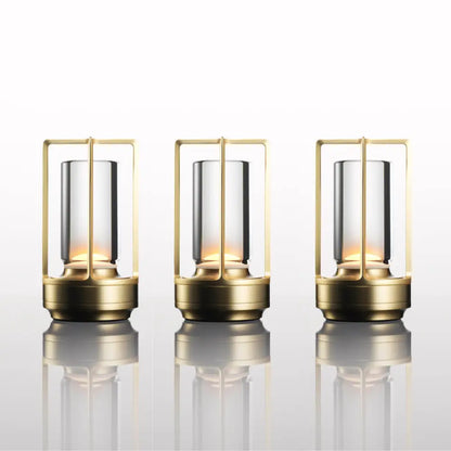 Three elegant brass-framed decorbites nordic rechargeable table lamps with clear glass and warm internal lighting
