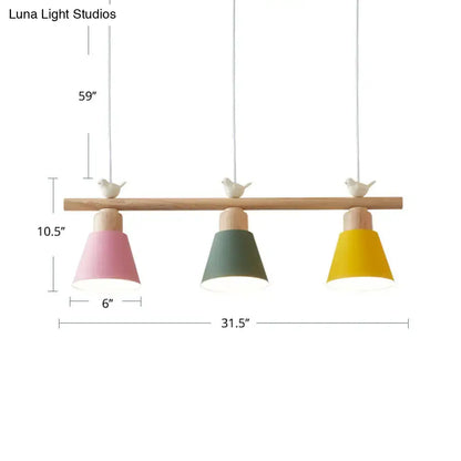 Pastel-colored three-light metal pendant hanging island light with wooden bar and bird finials for dining room decor