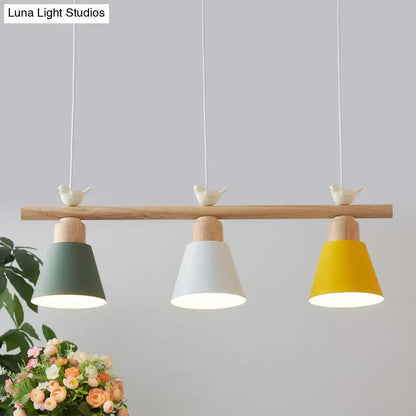 DecorBites™ nordic shaded hanging island light with three conical shades in sage green white mustard yellow wood bar