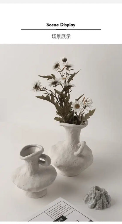 Decorbites nordic style ceramic flower pot in white with textured rounded body holding delicate white daisies
