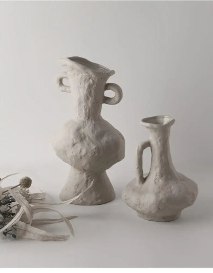 Two textured matte gray ceramic vases with organic looped handles in a nordic style ceramic flower pot white design