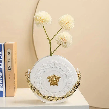 White nordic style ceramic flower vase with embossed patterns gold chain strap and medusa head clasp half face design