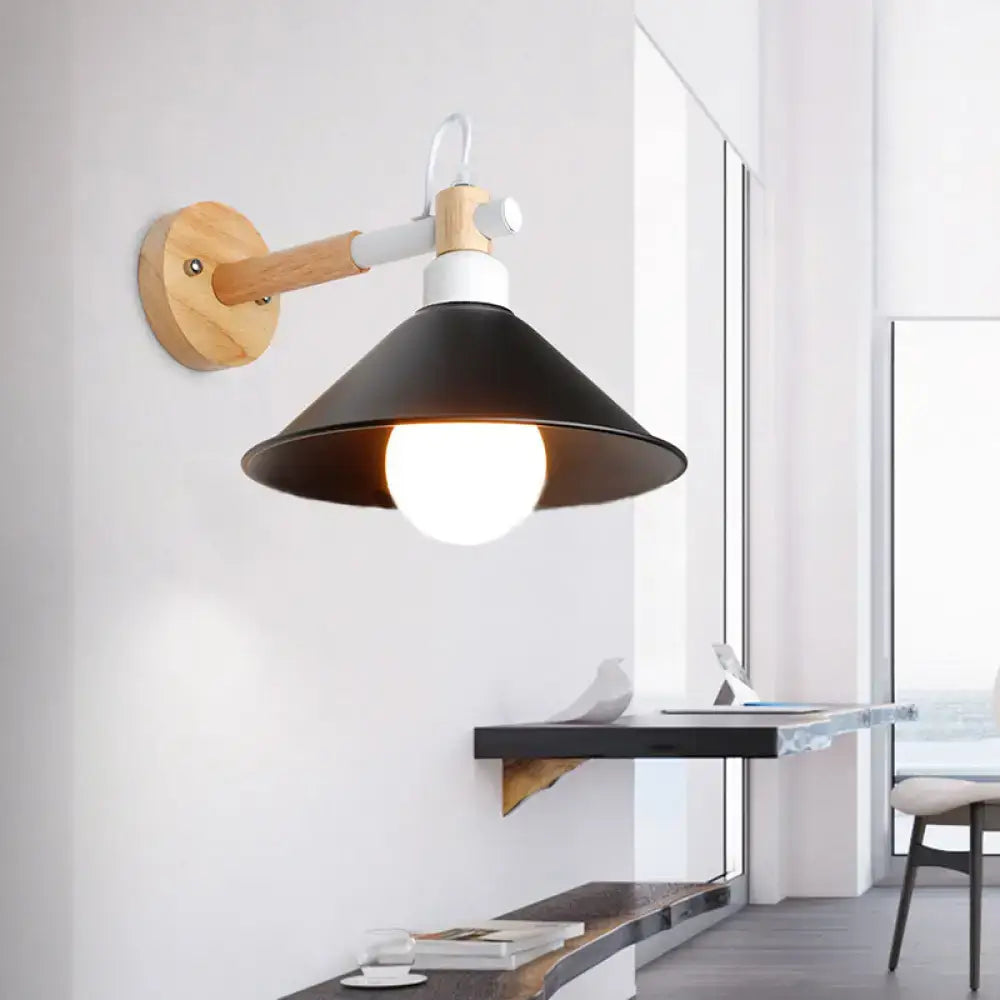 Nordic black and wood conic wall sconce with black metal shade and white accents mounted on wooden arm for bedroom lighting