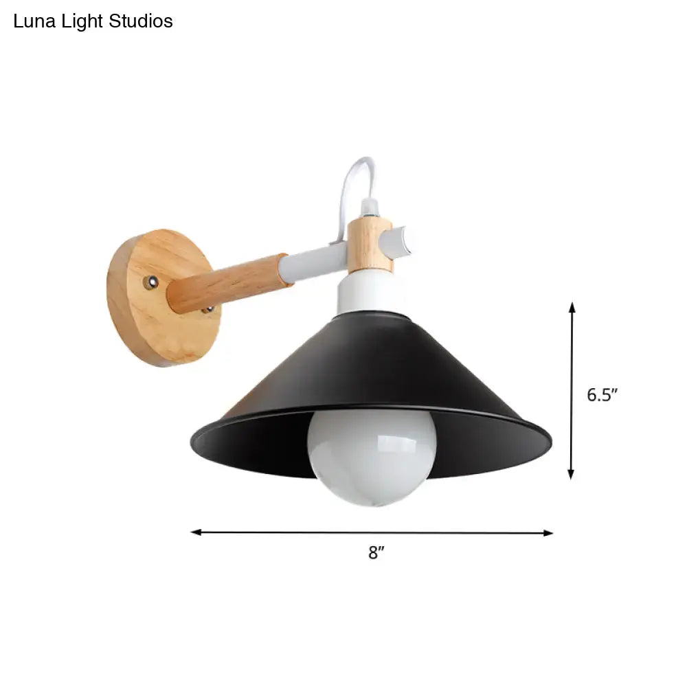 Black metal and wood conic wall sconce with circular mounting plate and white accents for bedroom lighting