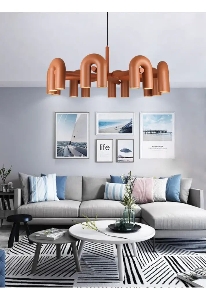 Copper-toned industrial copper pipe chandelier with curved arms and central rod for nordic shape led ceiling lighting