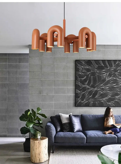 Terracotta colored decorbites™ nordic u shape led ceiling chandelier with curved tubular arms and minimalist design