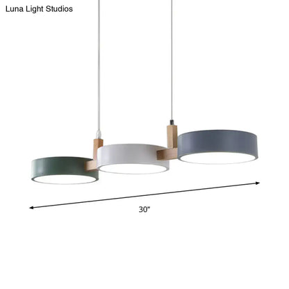 Modern three-light pendant fixture with matte sage green white and gray acrylic shades bulb included white warm light