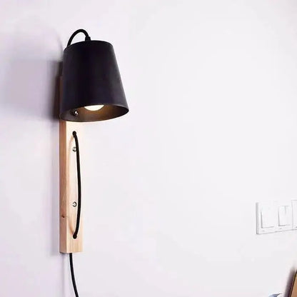 Black metal lampshade wall sconce mounted on light wood base with black cord for mida wall sconce decorbites nordic wood plug in