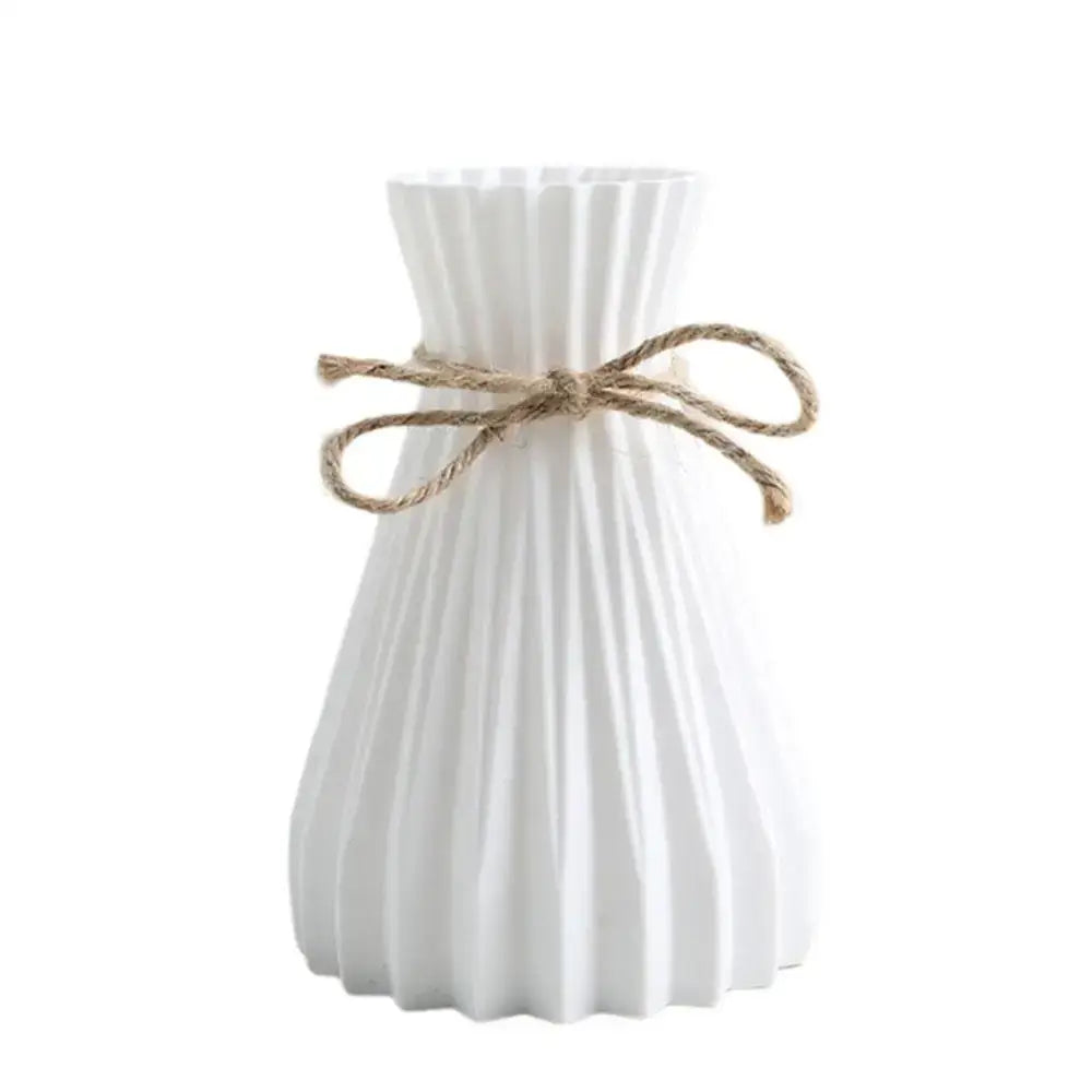 DecorBites™ origami style white plastic flower vase with vertical ridges and natural twine bow for elegant decor