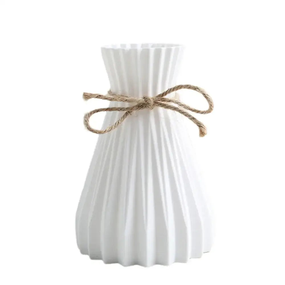 DecorBites™ origami style white plastic flower vase with vertical ridges and twine bow for decorative use