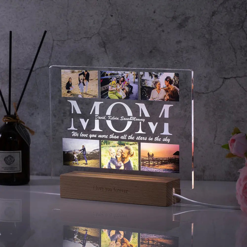 Clear acrylic lamp with custom photo and engraved mom text illuminated by wooden base with protective film