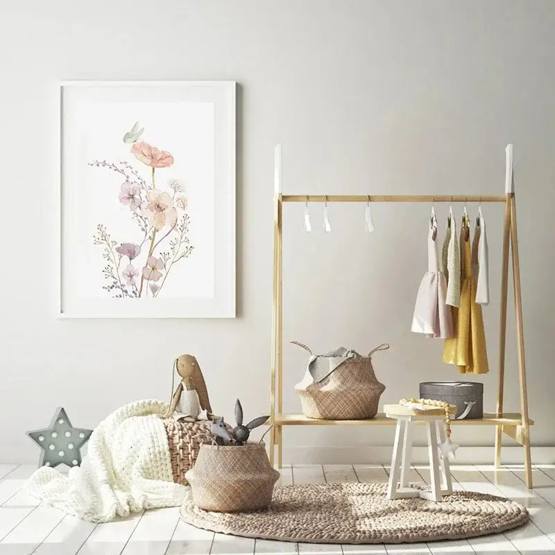 A framed decorbites™ personalized pink floral wall art featuring delicate flowers and a green butterfly in a white frame