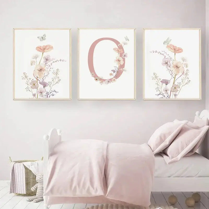 DecorBites personalized pink floral nursery wall art with delicate watercolor blossoms and butterflies in light wood frames