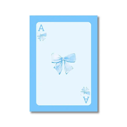 Light blue playing card with central watercolor pink bow and corner a symbols from decorbites pink bows wall art set