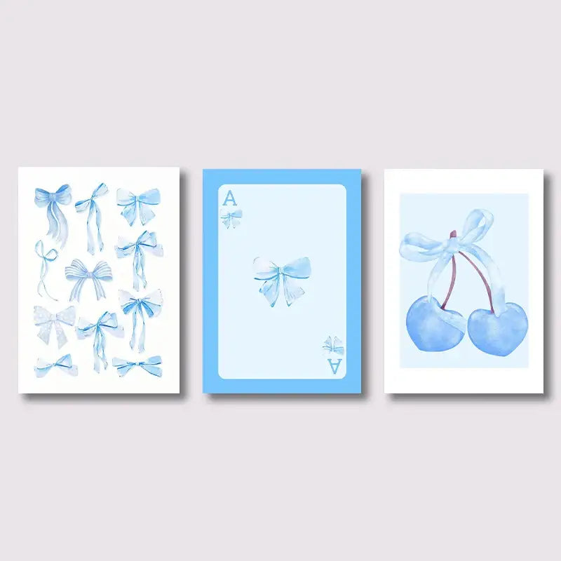 Set of three DecorBites™ wall art prints featuring blue bows, cherries, and an ace card in watercolor-style design