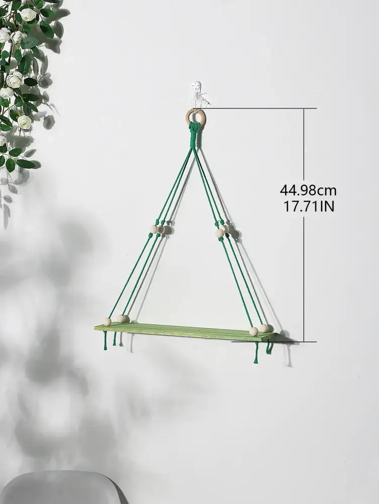 Green wooden macrame wall shelf with wooden beads and natural wood ring for kids room by DecorBites pink green