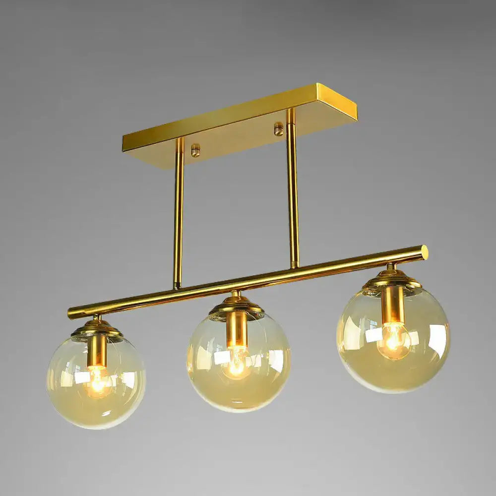 Decorbites™ postmodern brass island light with gold-toned metal and three globe glass shade fixtures ceiling fixture